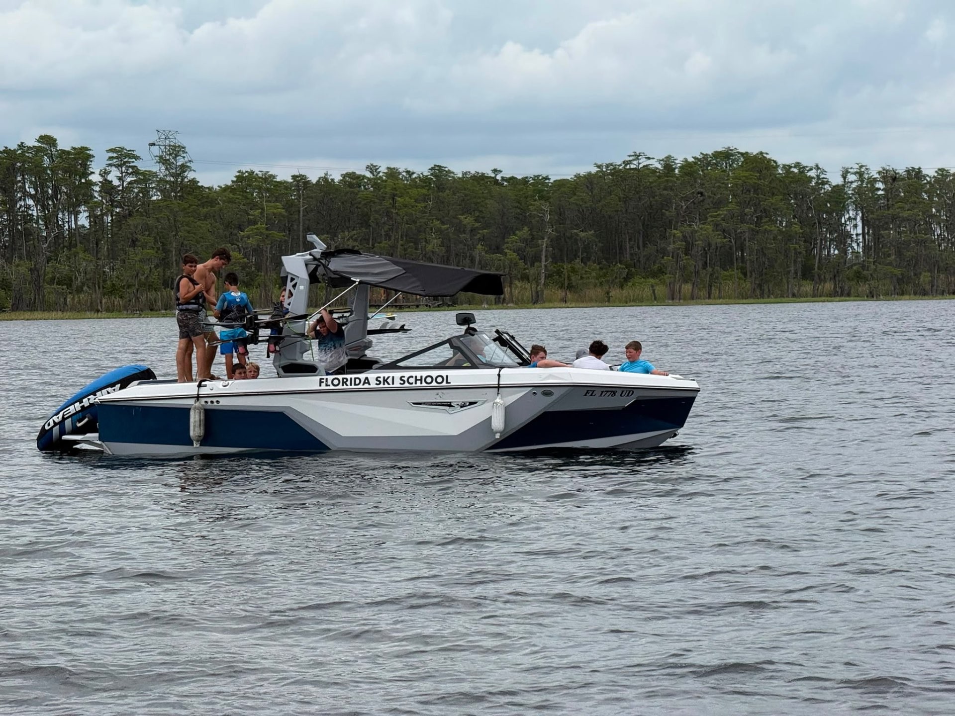 Campers and instructors aboard a Florida Ski School boat on the lake